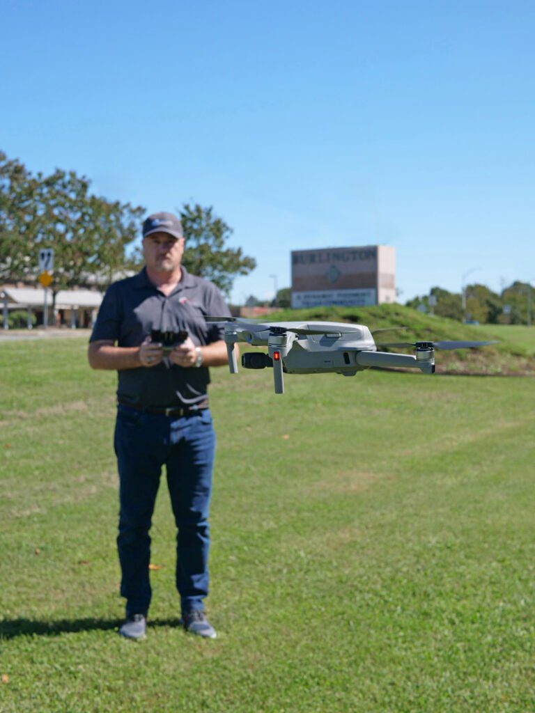 aerial videography and photography services near me: drone pilot flying a drone