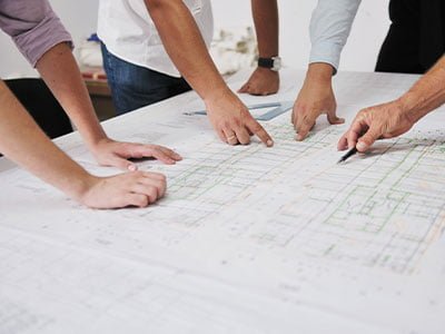 contractors meeting around blueprints