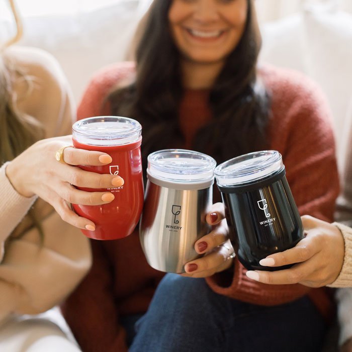people enjoying drinking from promotional product metal tumblers